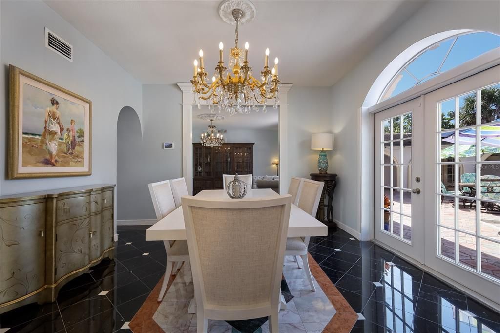 The dining room in the main house is perfectly situated between the kitchen and the living room.