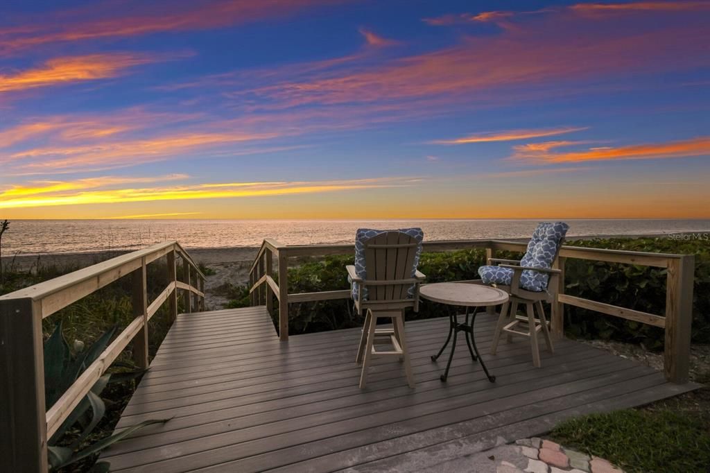 Refurbished deck where you can watch sunsets and only a few steps to put your toes in the soft beach sand.