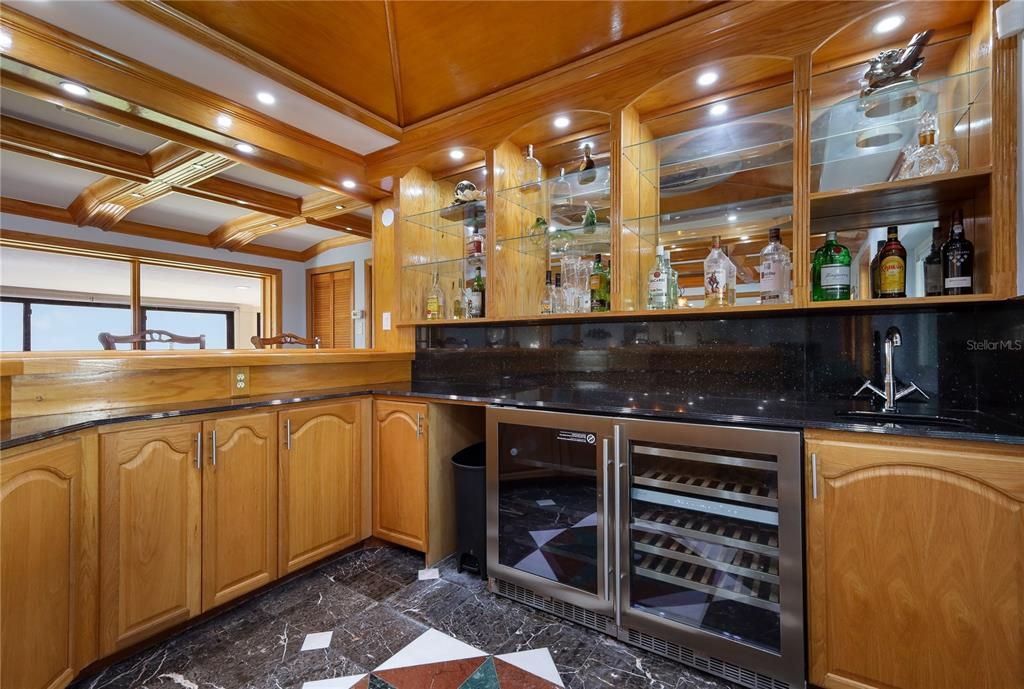 Equipped with sink, beverage and wine refrigerators.