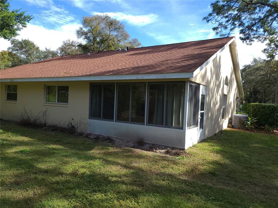 Back of Home w/ Enclosed Patio