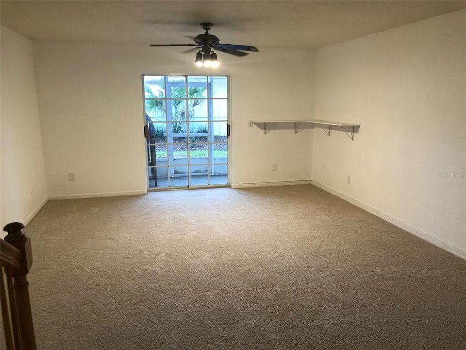 Lower floor bonus room with sliding glass door to lower patio