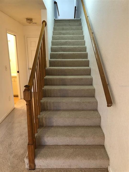 Stairway from bonus room on lower floor to main floor