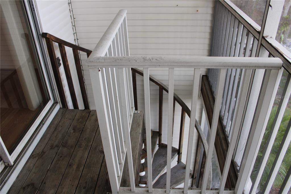 spiral staircase from main floor balcony