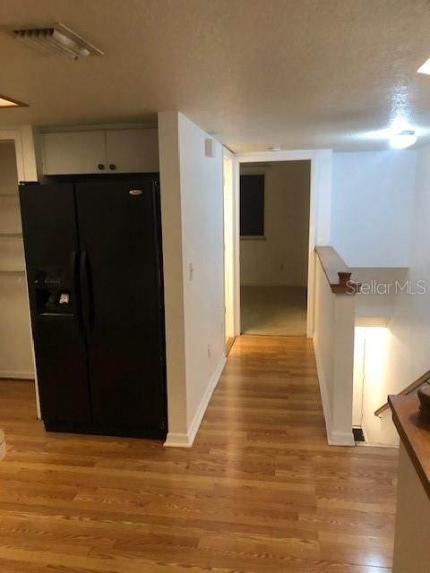 Kitchen landing area to main floor hall bath and bedroom