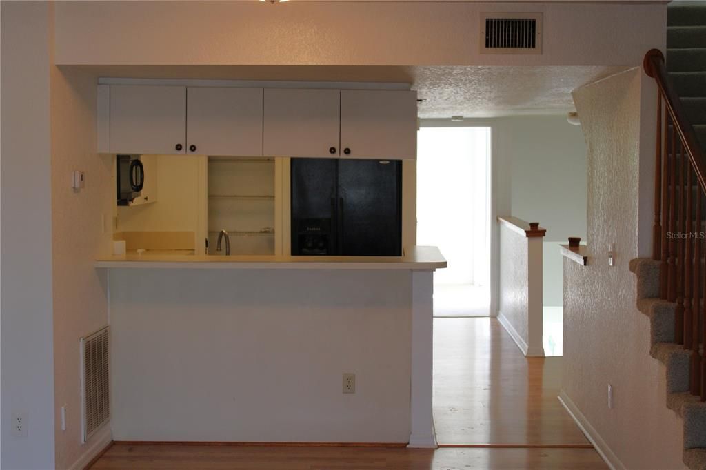 Kitchen landing area to main floor hall bath and bedroom