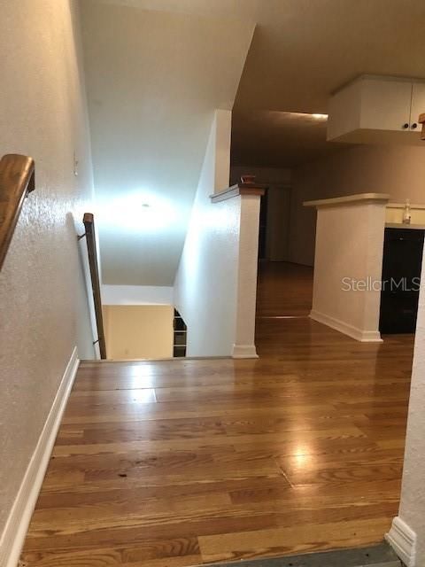 Kitchen area landing looking at stairway to lower floor to bonus room