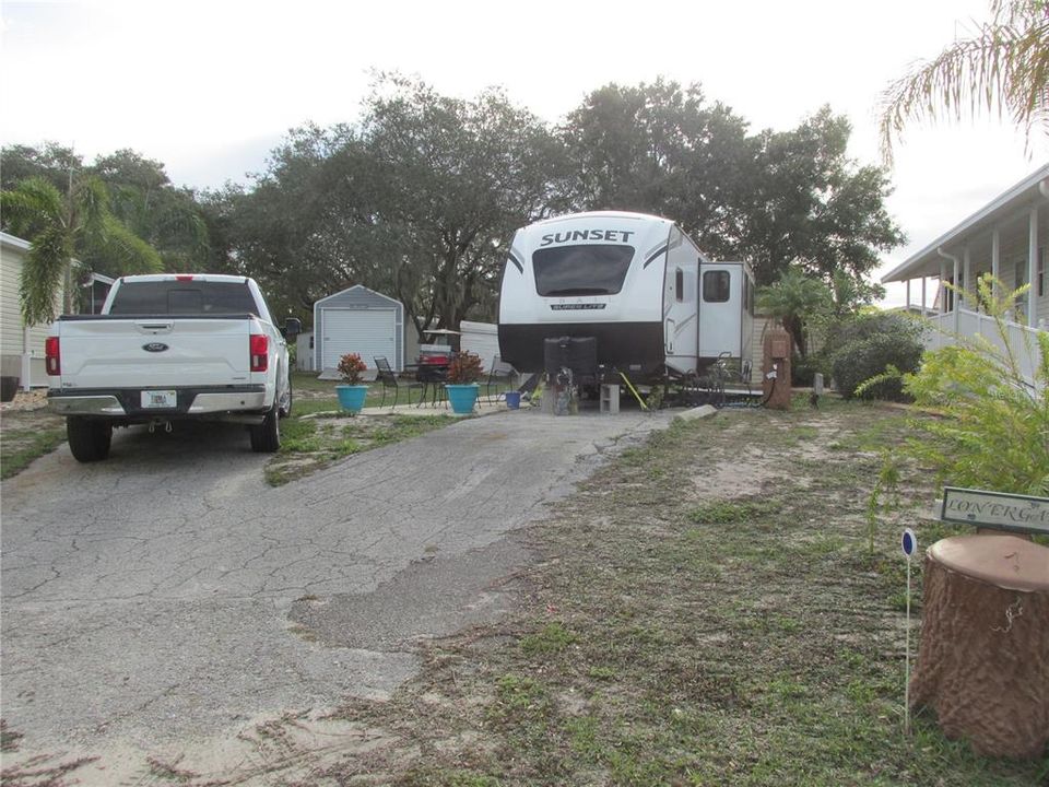 There is plenty of parking for an extra vehicle. (RV on site is not included in the sale.)