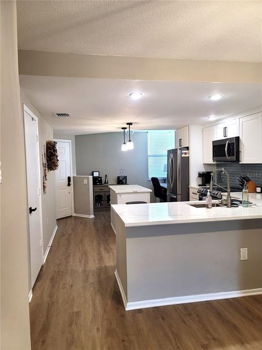 Kitchen looking to front door area