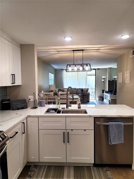 Kitchen looking out to dining and living area