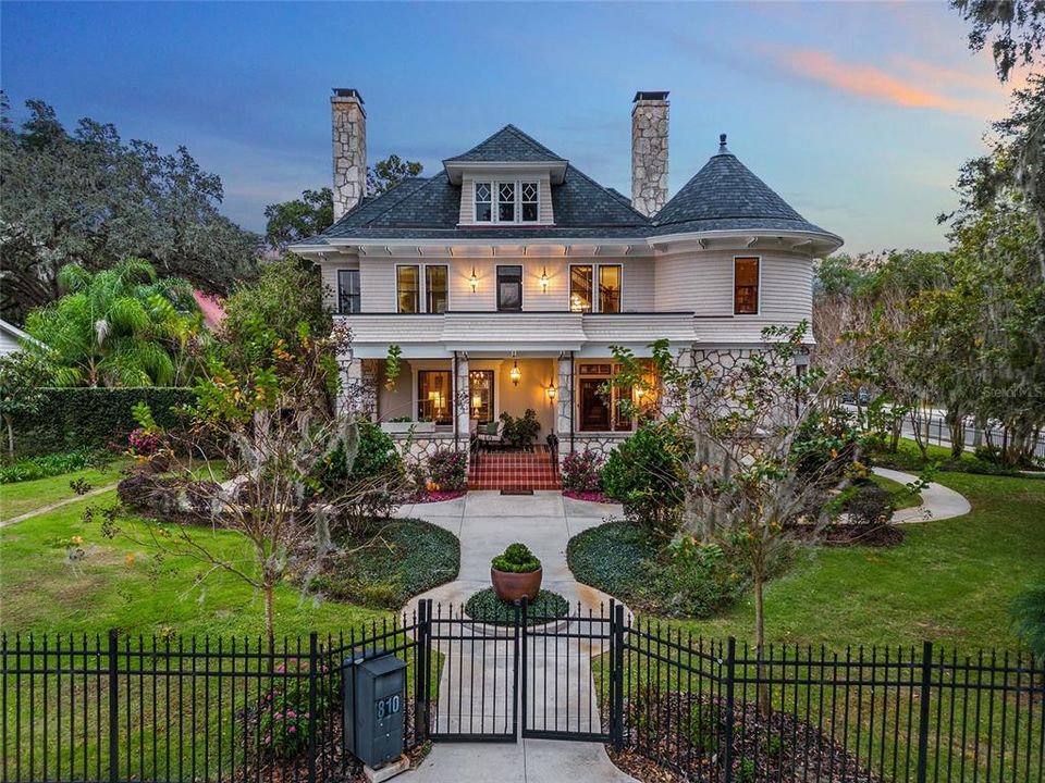 This Historic District corner property with it's stained-glass windows and original screened doors has stone walls and columns with porches meant for enjoying