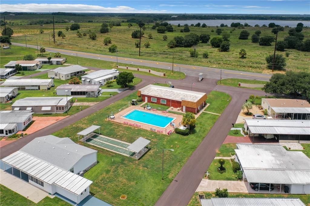 Aerial of the heated pool, clubhouse and shuffleboard