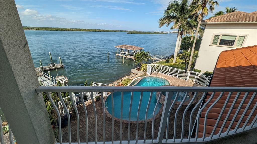 Second floor porch overlooking pool and river