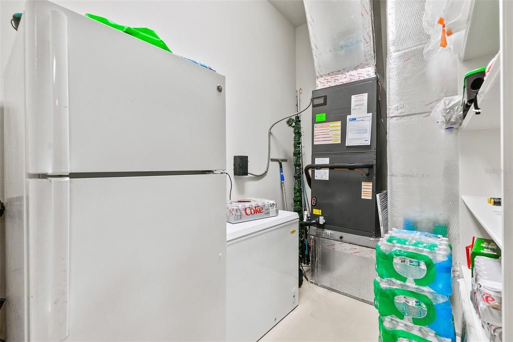 Climate controlled storage room in garage