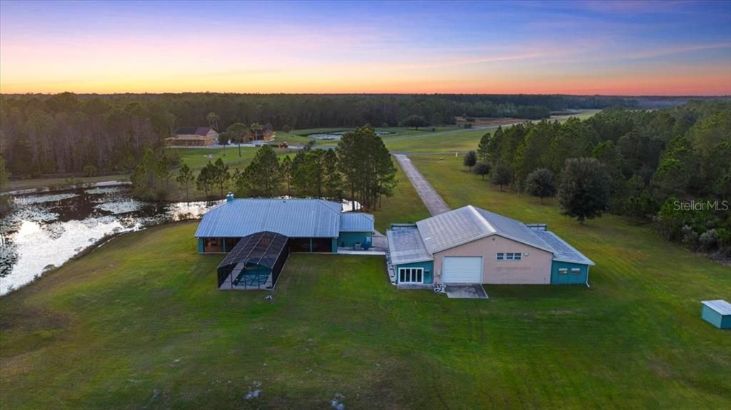 Rear view of home and hanger