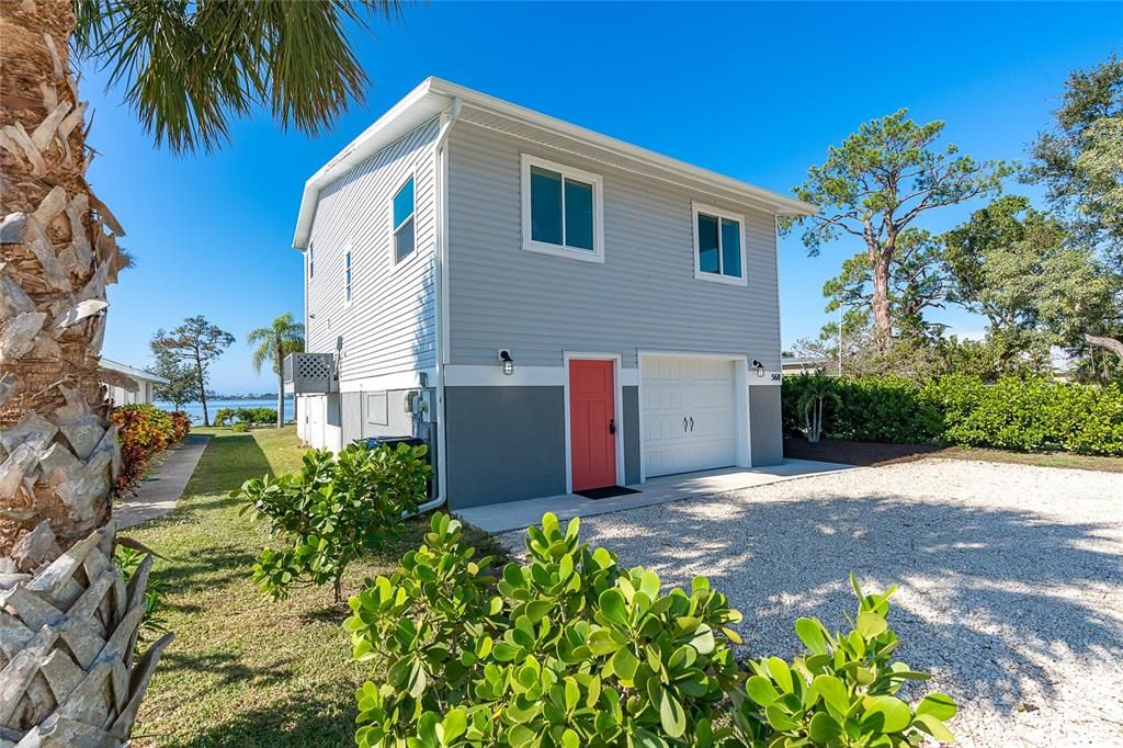 Completely remodeled Bay Front home with 2 separate living areas or opens to one. Spacious landscaping outlines the property.