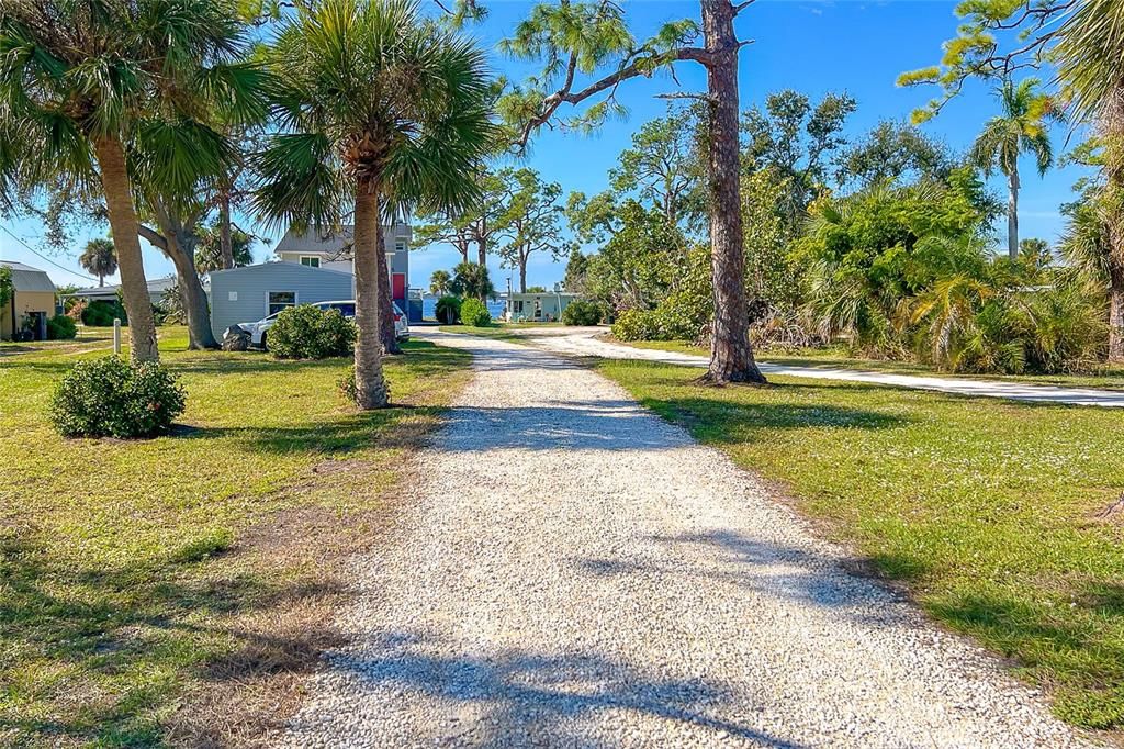 This driveway sets this property away from the road allowing it to be private to the Bay .