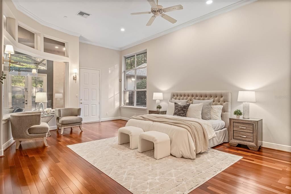 Master bedroom with sitting area. Natural light abounds in this peaceful retreat.