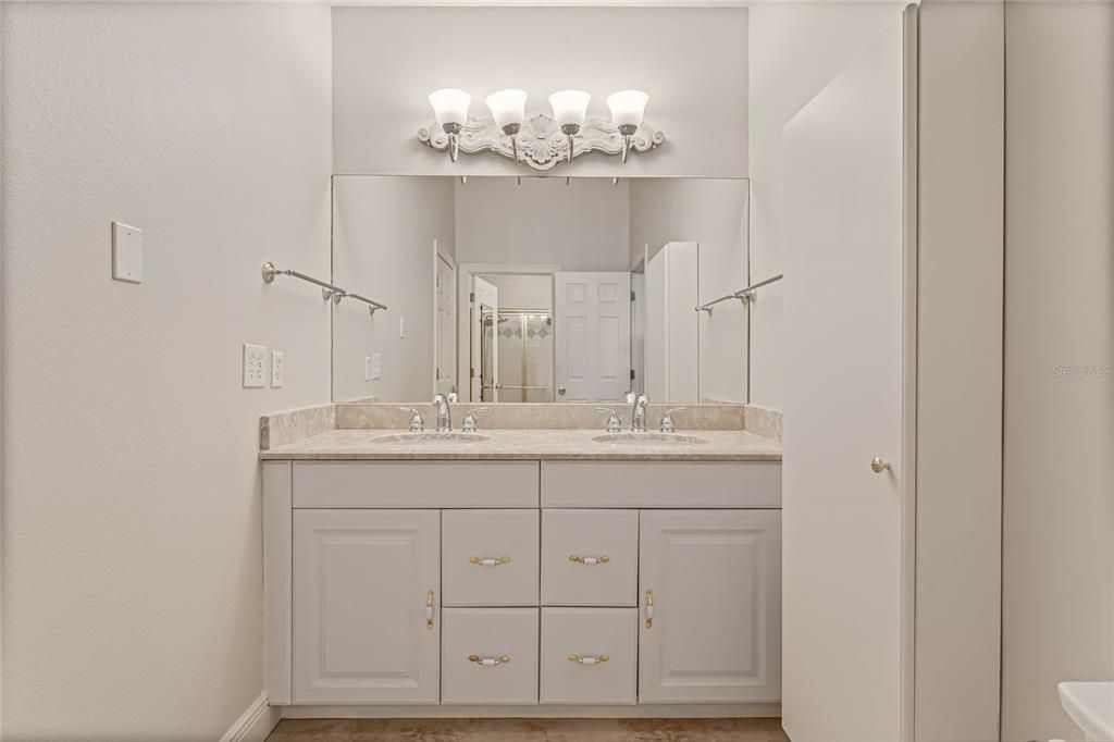 Jack and Jill bath with separate shower and sink. Perfect for sharing the space!