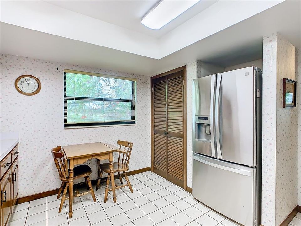 Plenty of room in the kitchen for a dinette set and there is also a pantry.