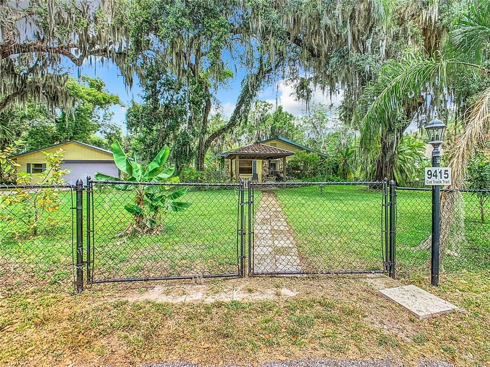 Fenced in yard, the property is comprised of the home, detached 2 car garage with workshop, detached steel building/workshop/RV and/or Boat storage.