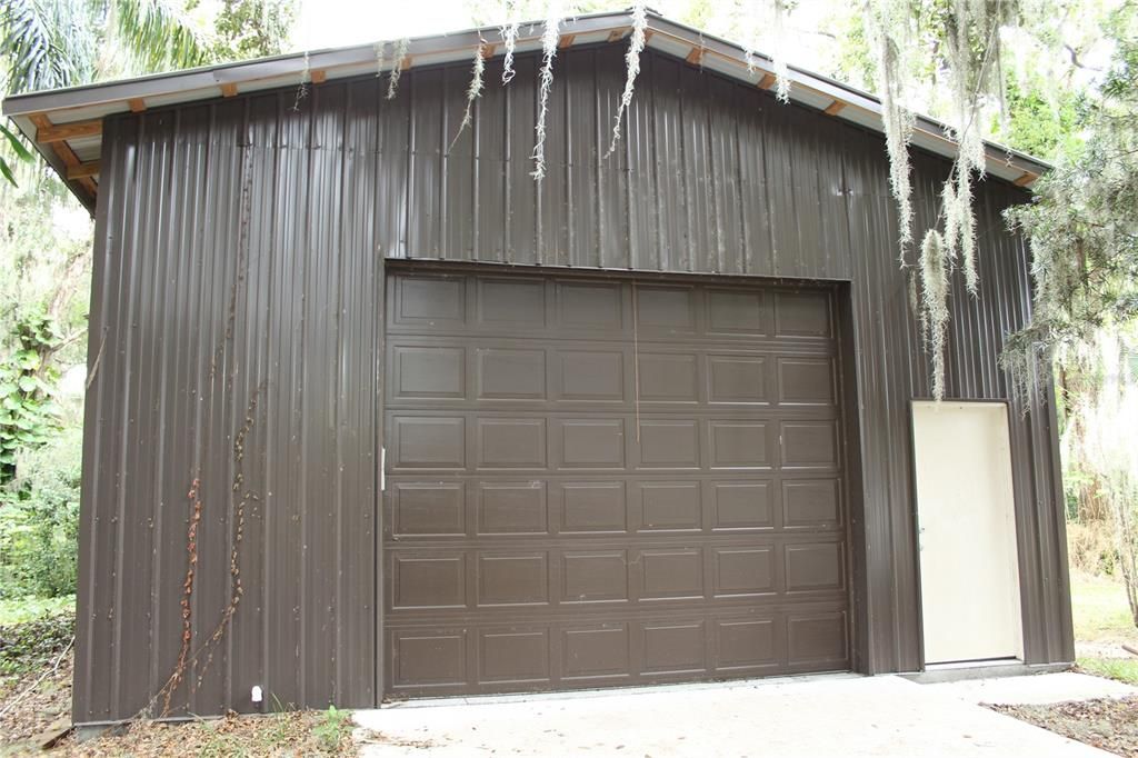 Front view of RV Storage / Boat Storage / Man Cave / Workshop.  There is a large overhead walk door on both the front end and side of the building.