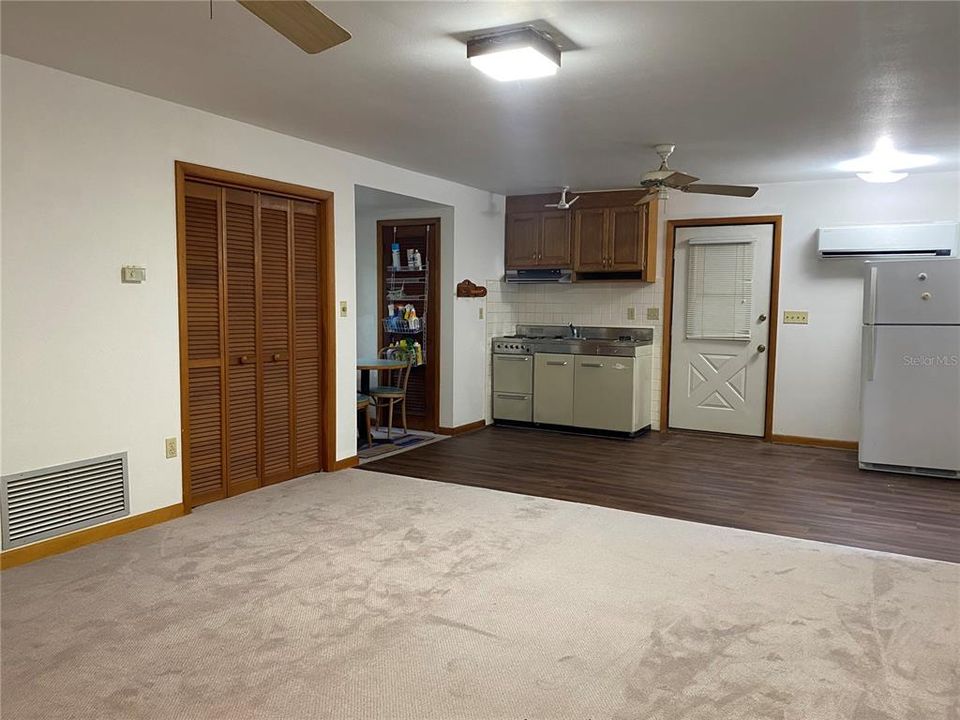 Kitchenette and dinette area.  Living room has new carpet.