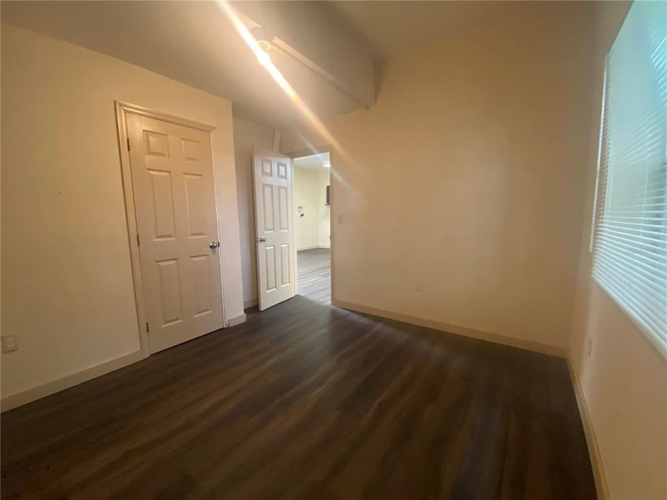 Back bedroom door opens the dining room.