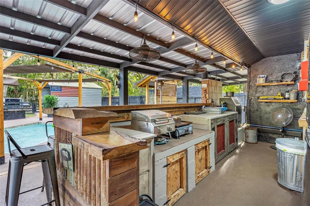 Back Porch Area with Appliances and Big Screen TV