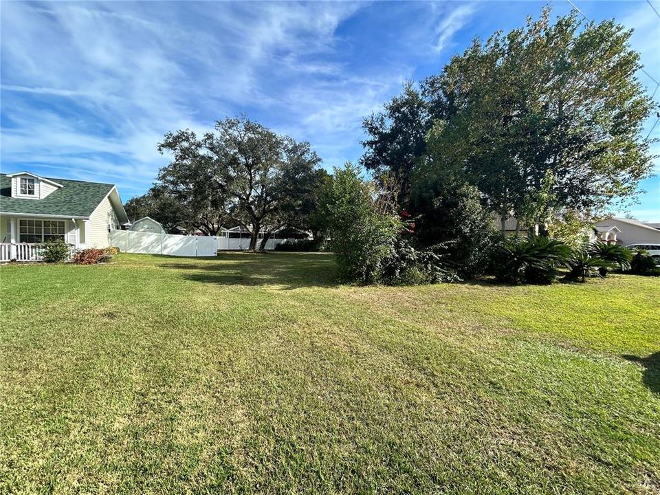 View from the road. There is a small buffer of plantings for privacy as this home site was at one time being utilized by the adjacent property owner.