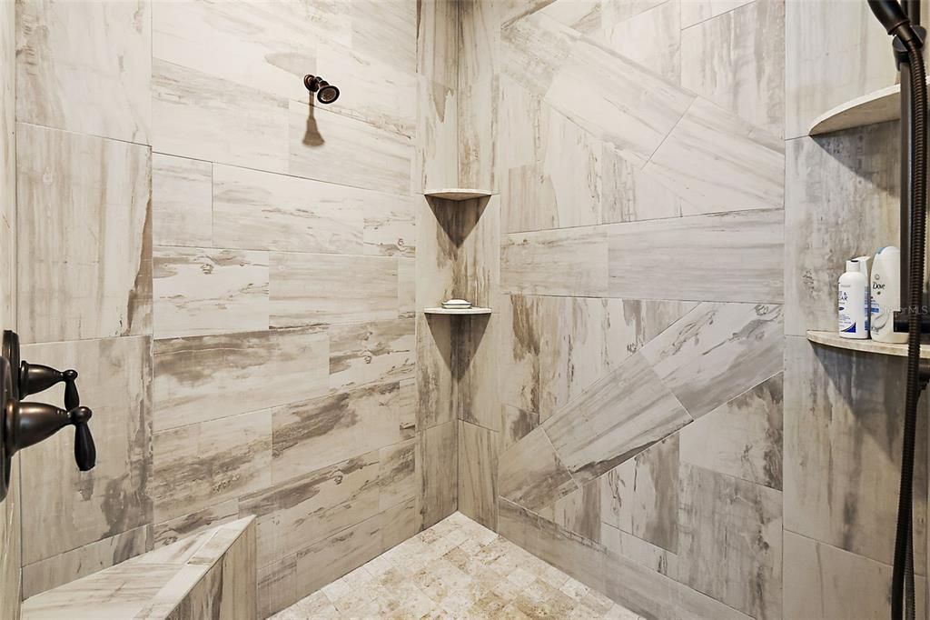 Stunning custom shower stall with double shower heads.