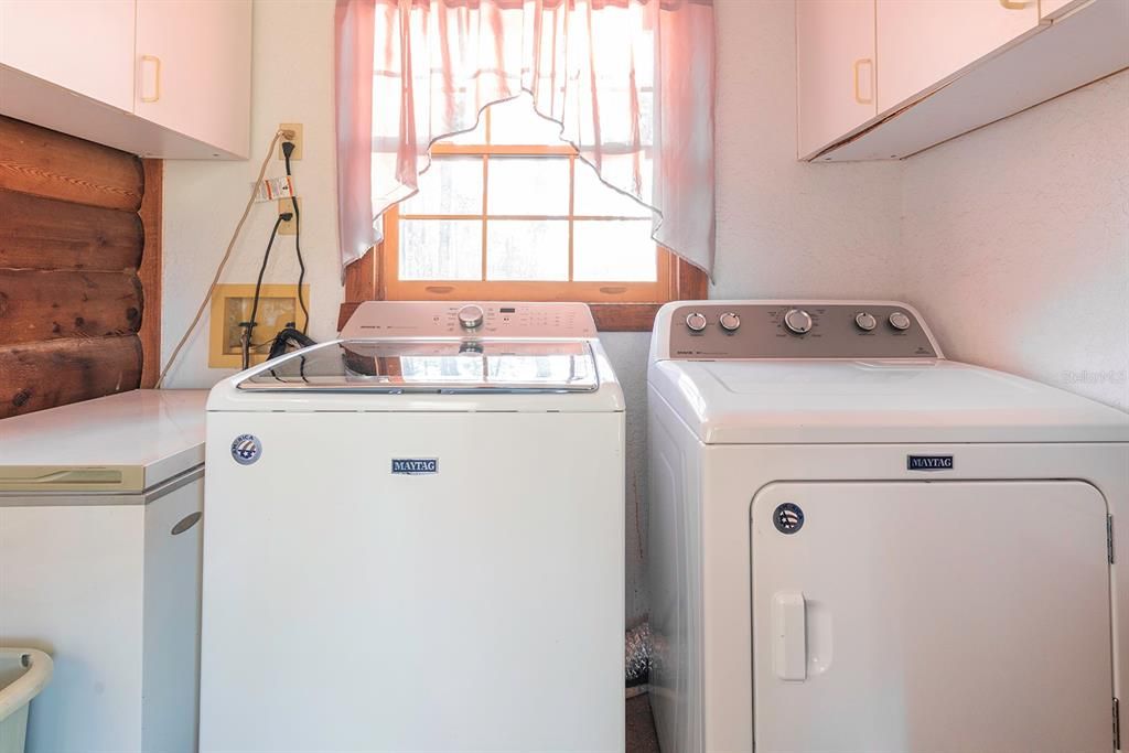 Laundry room.  Washer & dryer convey.