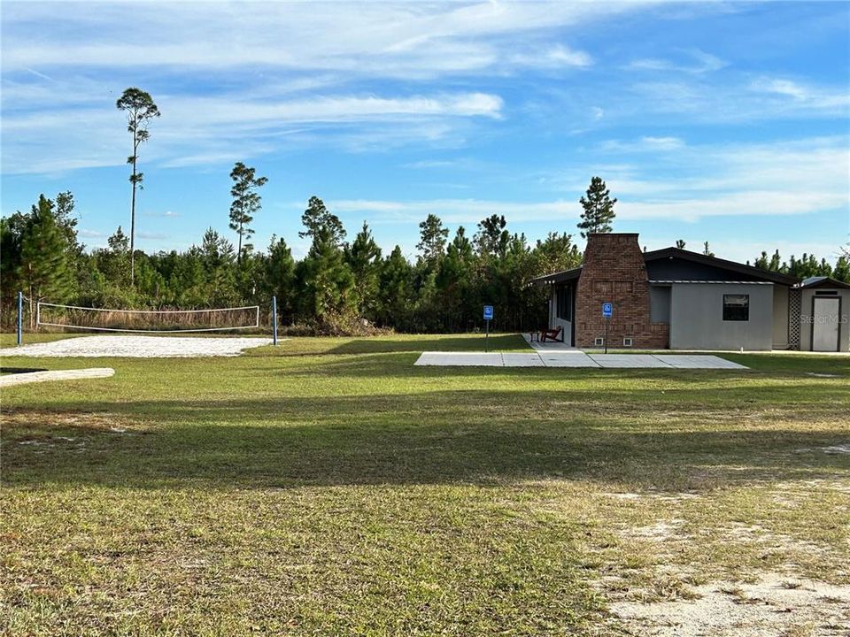 Community building and volleyball court