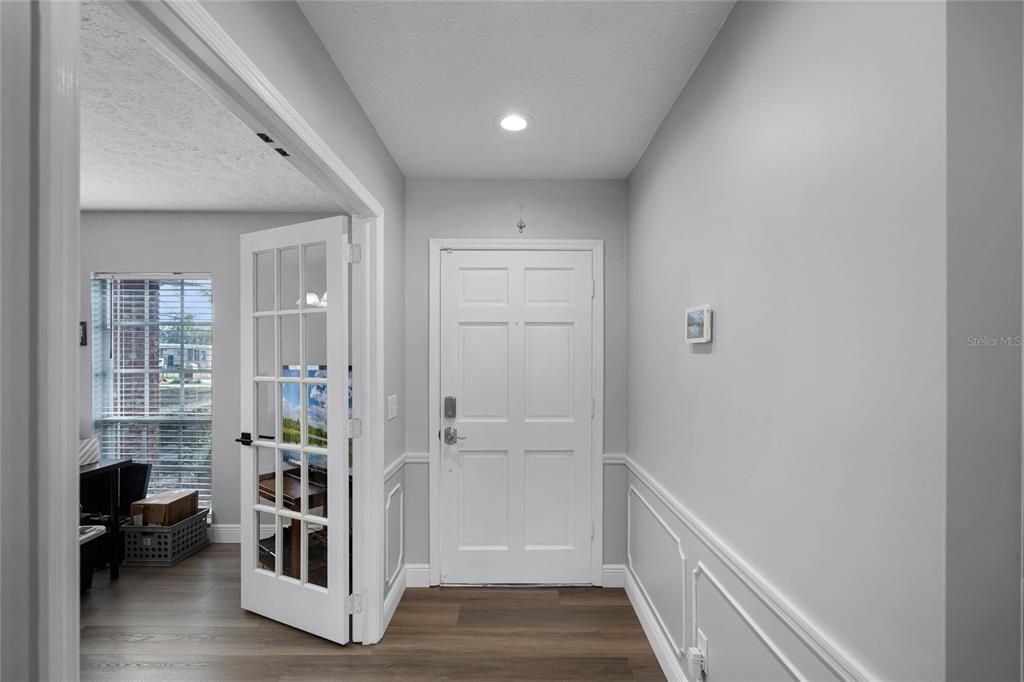 To the right of the front door you are greeted with french doors that lead into the Bonus Room/Office.