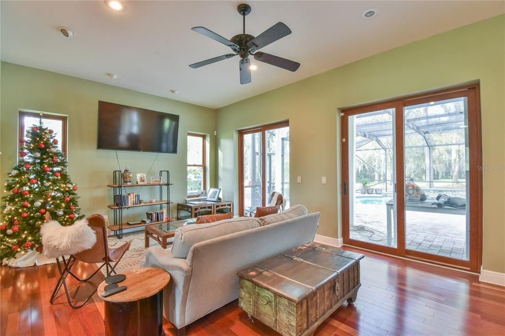 Living area looks out to covered pool