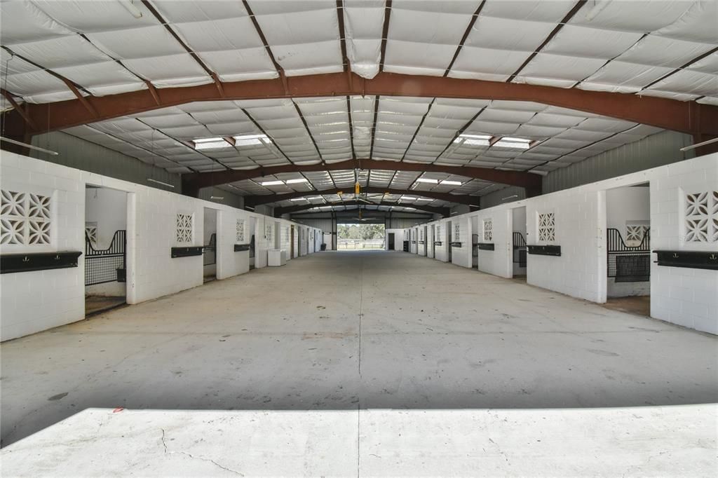 30' wide aisle ( drive right in), 2 newer Big Ass Fans, wash stall, feed room, laundry and bathroom.