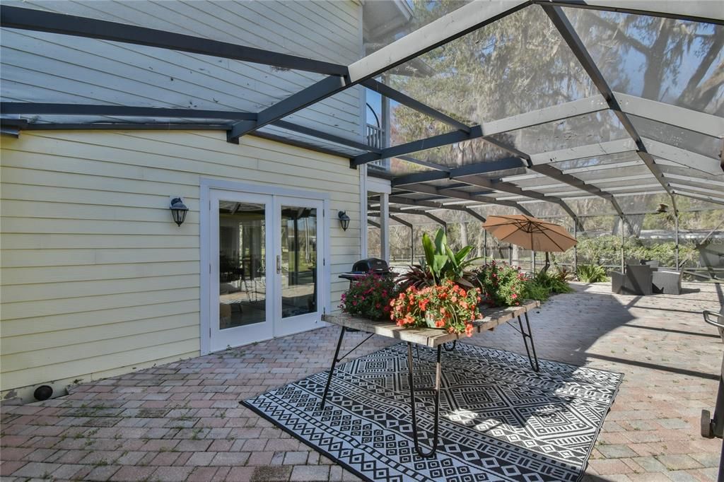 caged pool area with entrance off kitchen