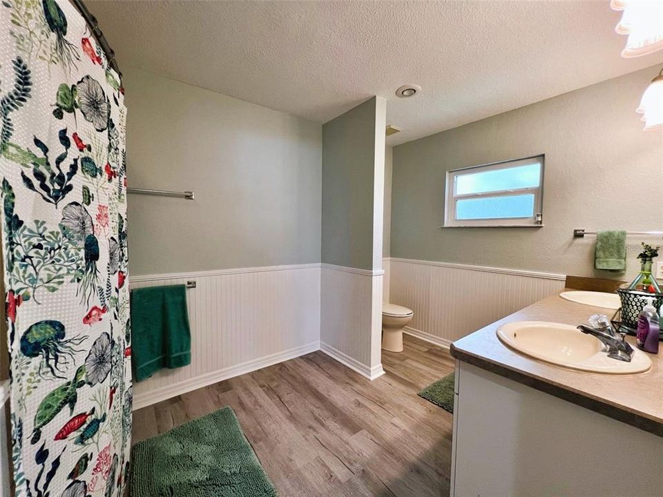 Primary bathroom, tub and shower