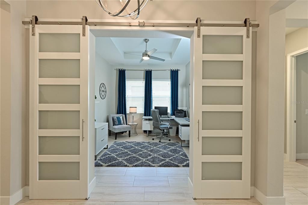 Barn doors provide privacy for the flex room.