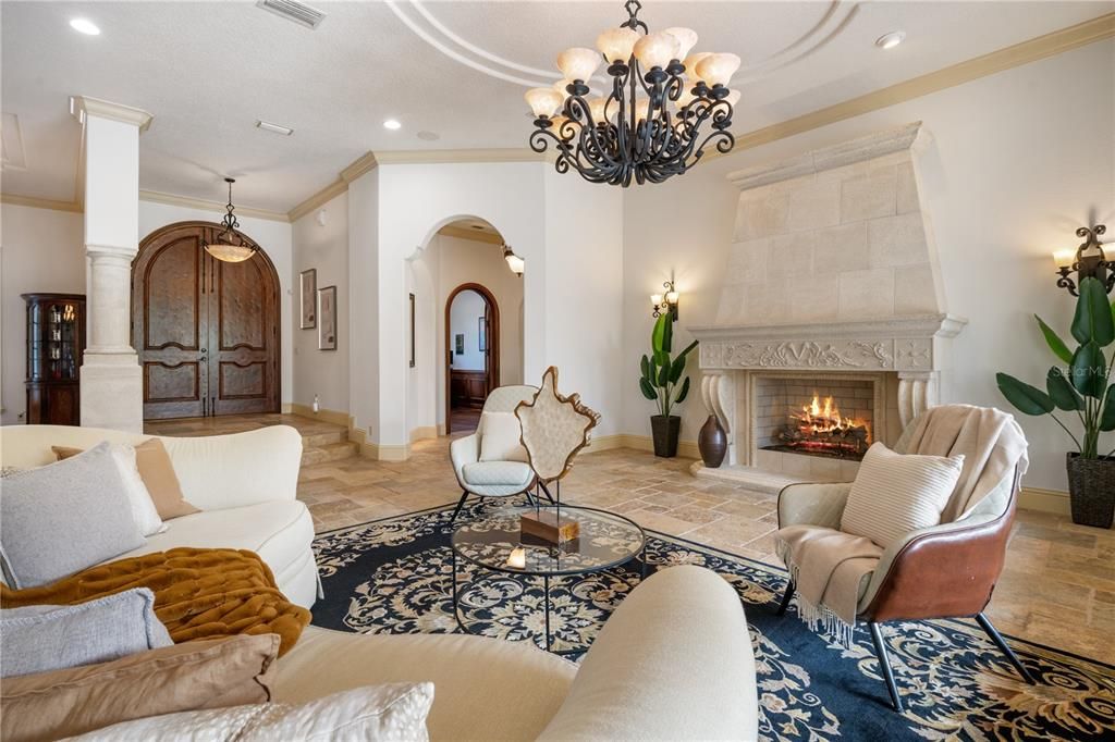 Massive cast Stone Fireplace sets the cozy ambiance