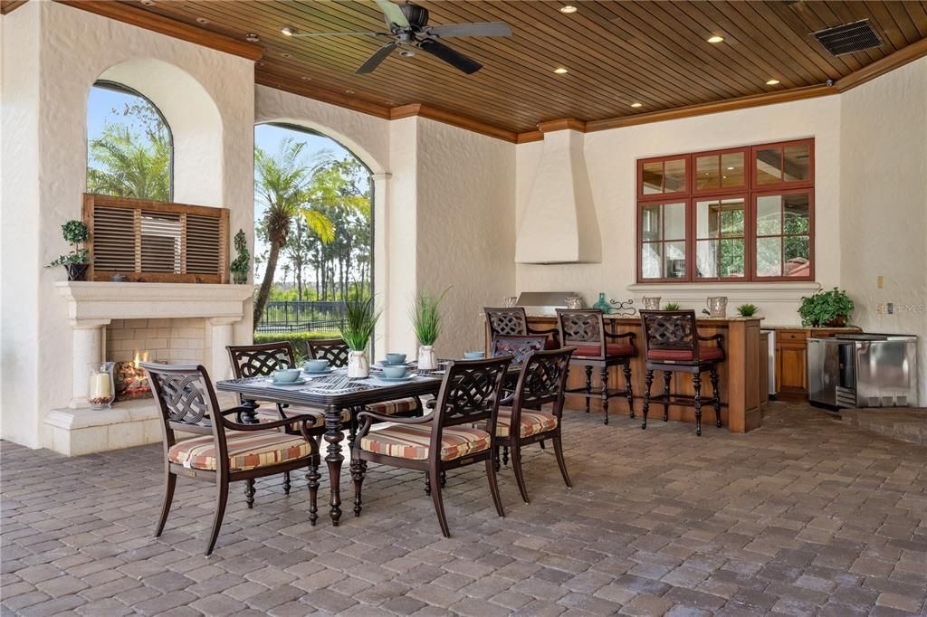 Outdoor Living Area with Fireplace and large hospitality bar & grill