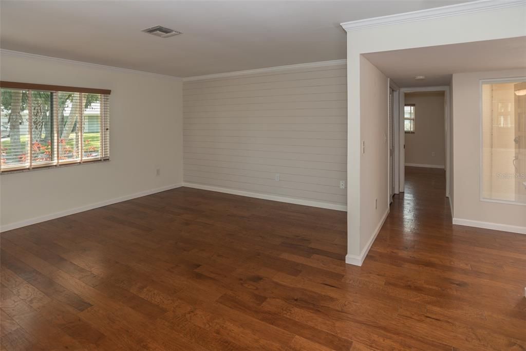 Living area with hall leading to master bedroom
