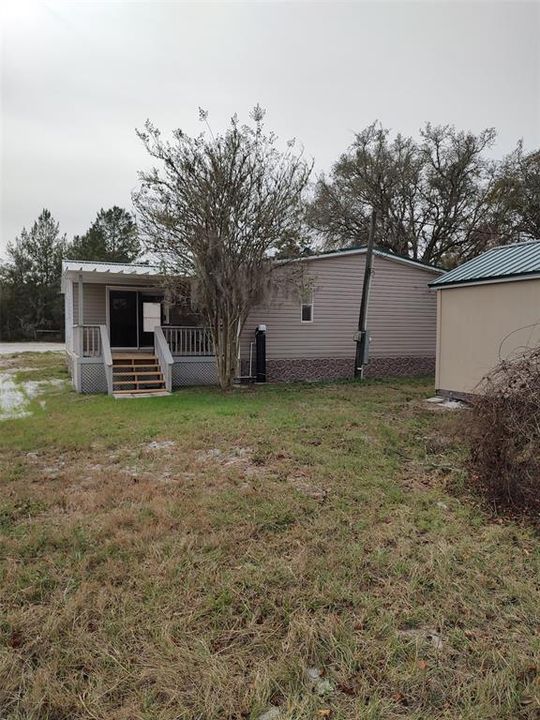 Rear view of home with back porch