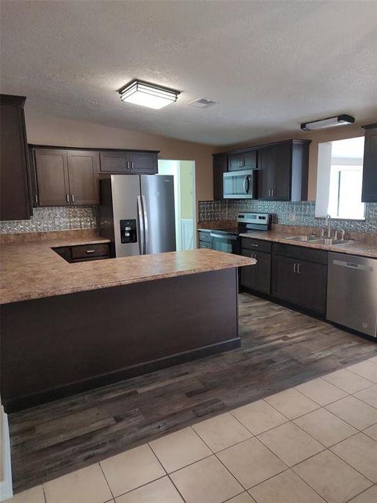 Kitchen has nice bar area