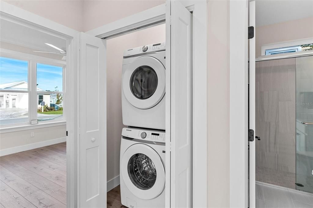 Utility Closet with Stackable Front Loading Washer and Dryer