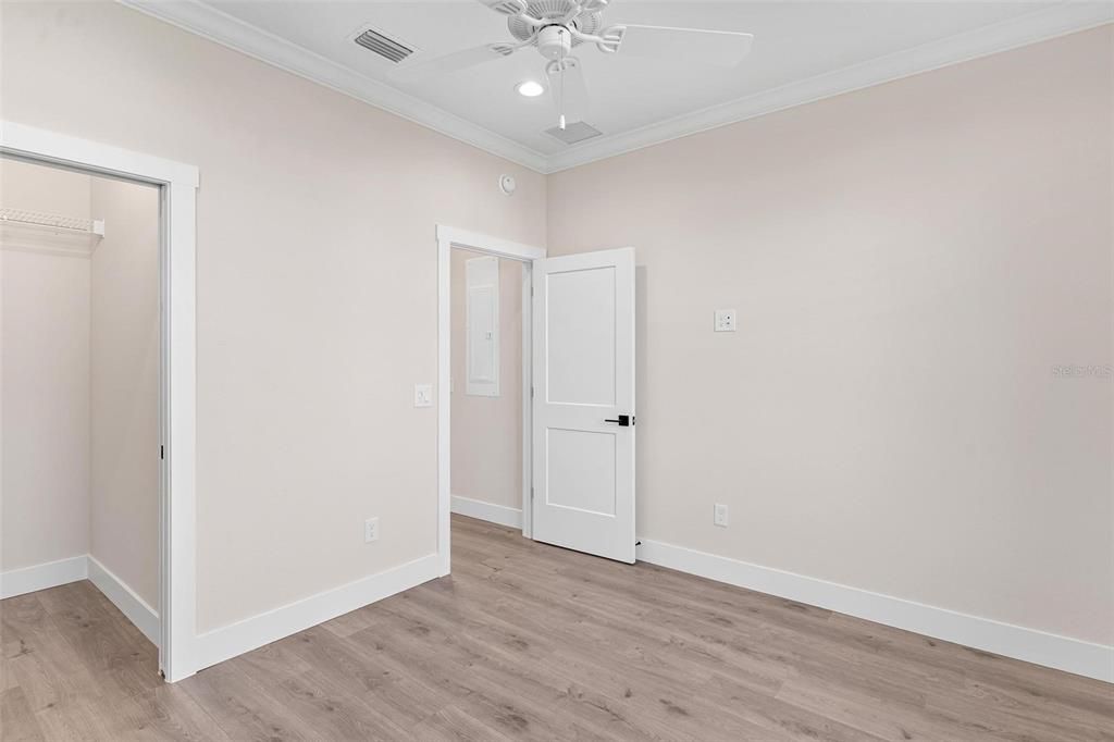 Bedroom 2 with "Wood Look" Laminate Flooring and Walk-in Closet