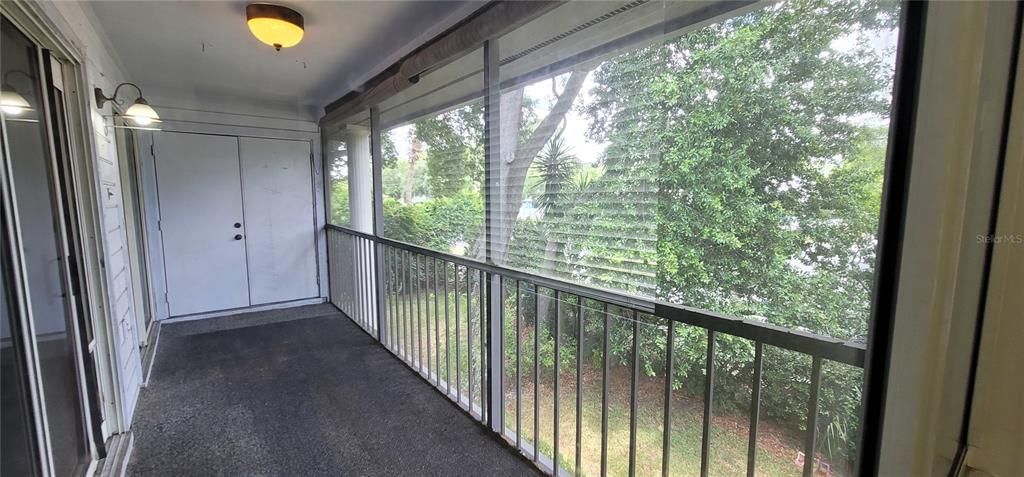 Shaded view of your private screened porch  from Bedroom 2. Full sized washer & dryer included in your Laundry space.