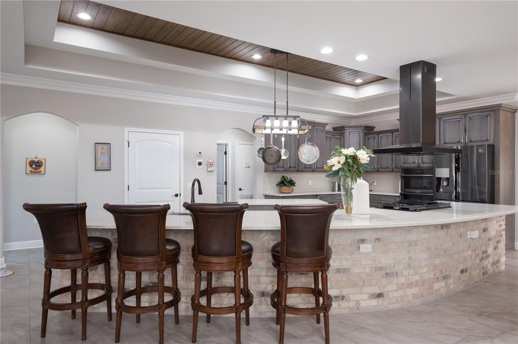 Barstools at large island in kitchen