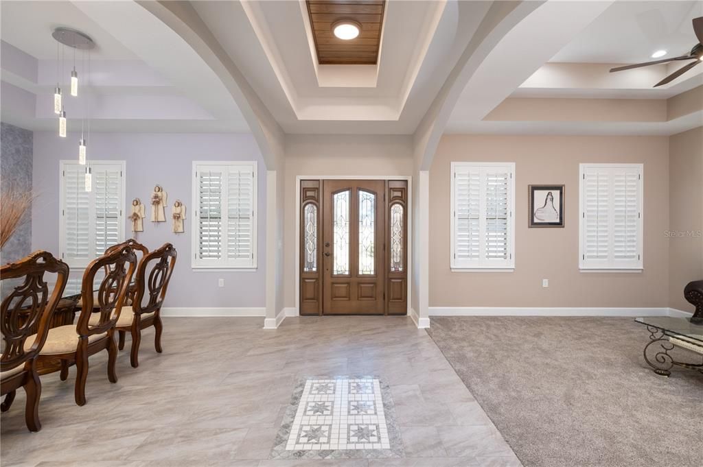 View of front door entrance, Formal dining room to the left and formal living room to the right