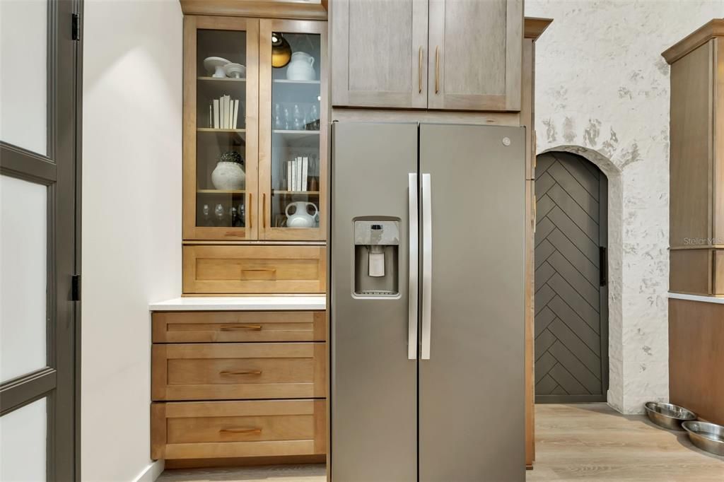 across from the coffee station there is the refrigerator and storage!! There is a ton of storage in this kitchen.