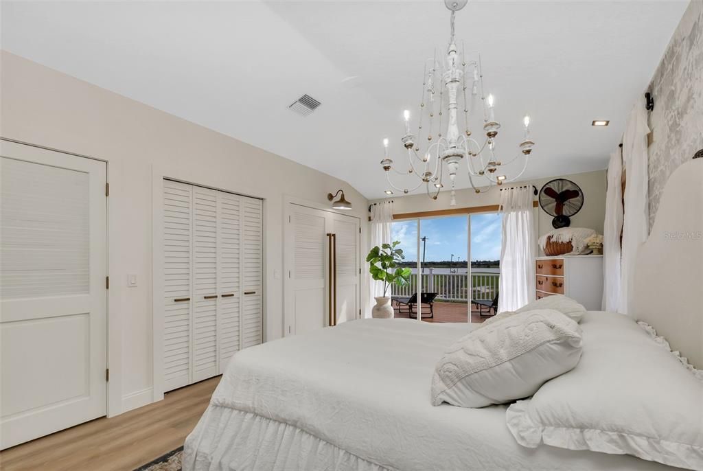 upstairs primary bedroom. closet space galore! Views of the golf course and a deck high enough for  fantastic views